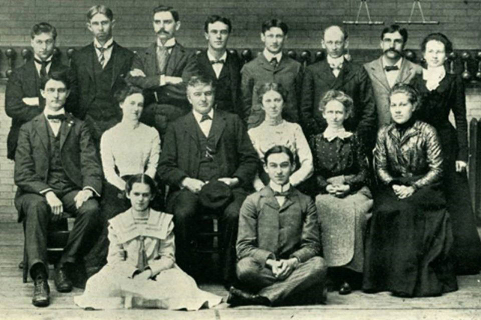 Black and white faculty photo including Ange Milner from the 1900 Index