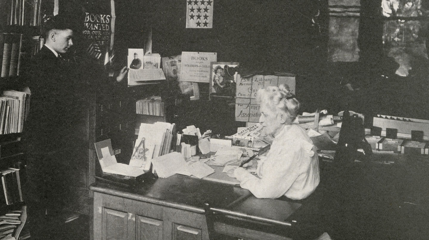 Ange Milner interacting with a student in her office