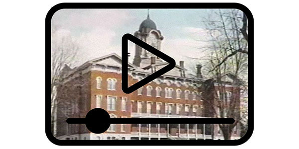 photo of Fell Hall with play icon