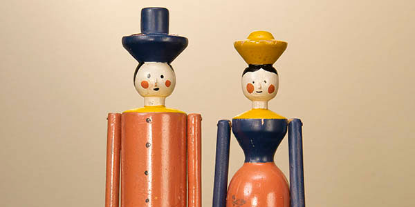 two wooden dolls