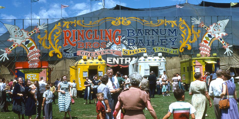 Ringling Barnum Circus, four ticket and office wagons and marquee or main entrance. July 7, 1953. 