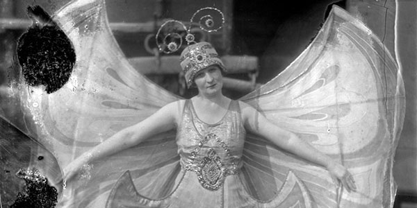 black and white photo of a woman in a circus costume