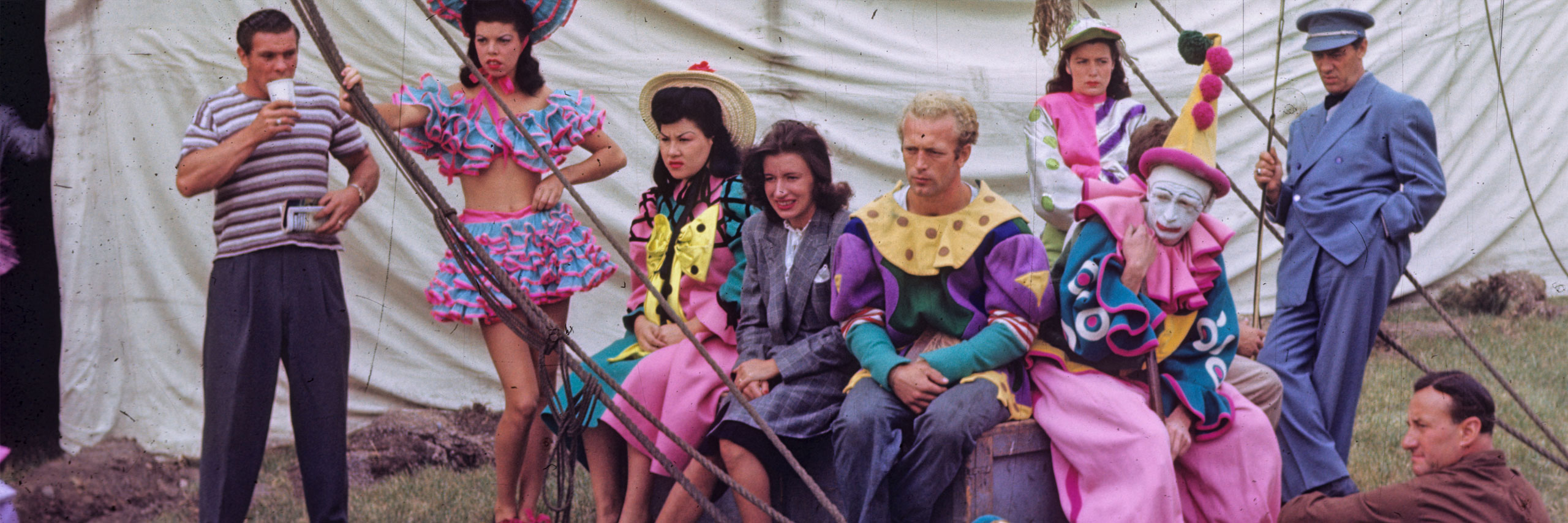 circus cast posing sitting outside in costume