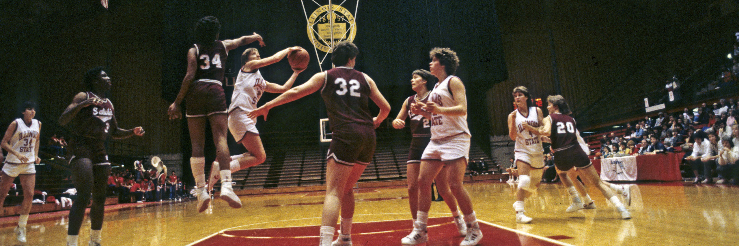 Photo of basketball game featuring ISU players