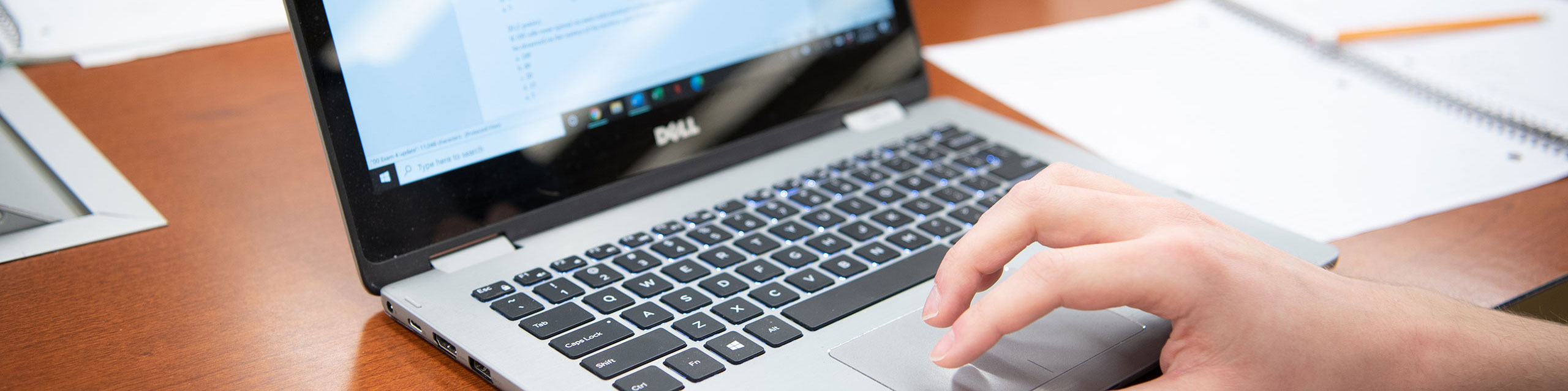 A student working on a laptop.