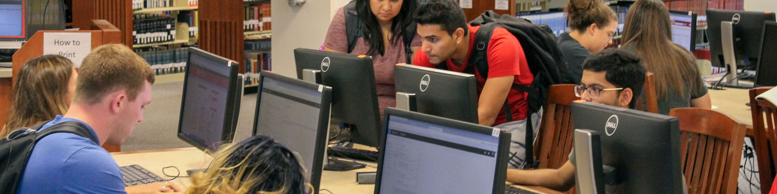 Students studying and working at Milner's workstations.